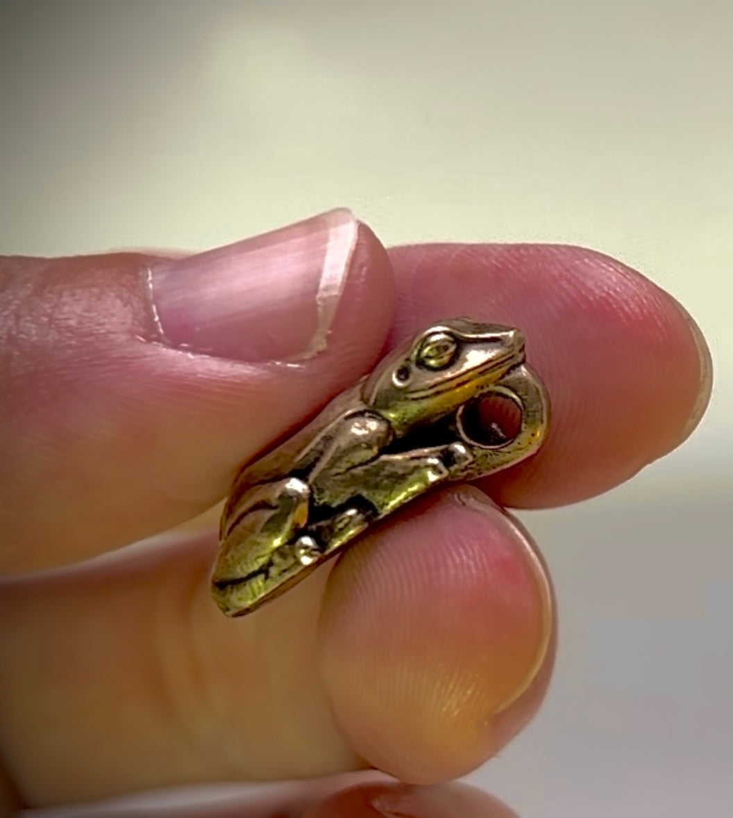Coqui, Bronze pendant, $30