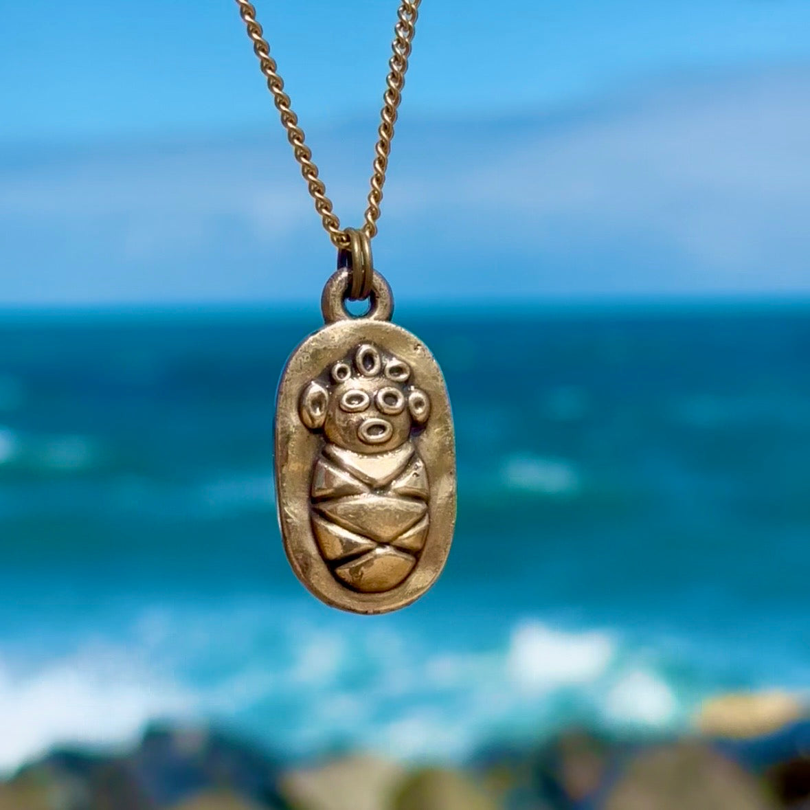 Bebe Taino, Bronze Pendant, $30