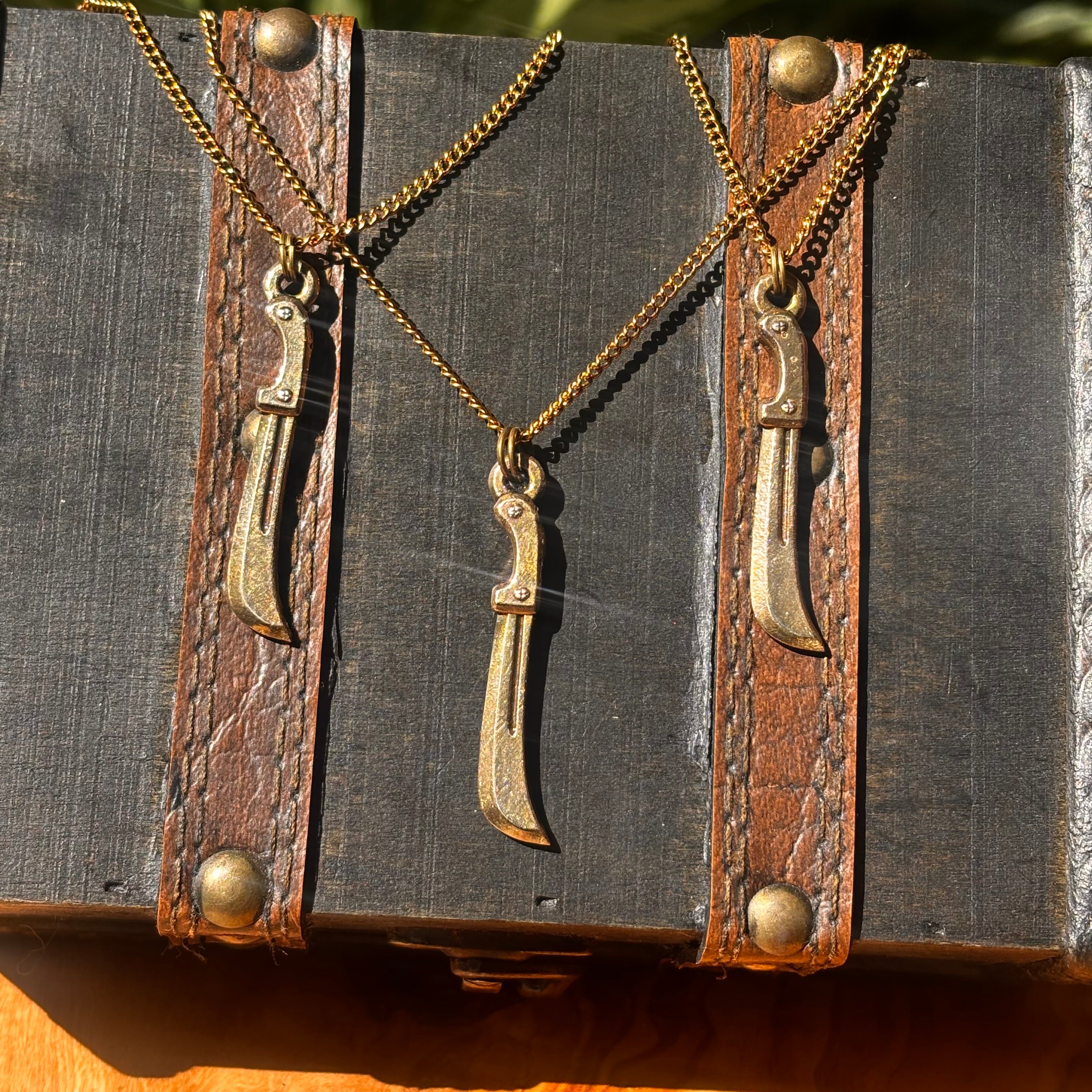 Machete, Bronze Pendant, $30